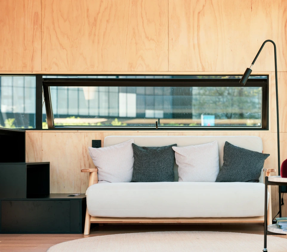 A living room with a couch and a table